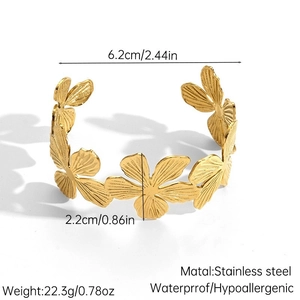 Gold stainless steel open flower cuff bracelet with detailed textured petals and 2.2cm width
