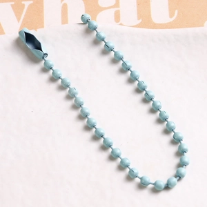 Detail of light blue coated metal ball chain with connector for DIY crafts and jewelry