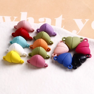 Macro view of colorful matte heart magnetic clasps for DIY jewelry making and crafts