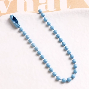Detail of blue coated metal ball chain with secure connector clasp for DIY crafts