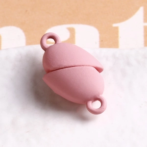 Macro shot of pink matte magnetic jewelry clasp with double loops for DIY bracelet making
