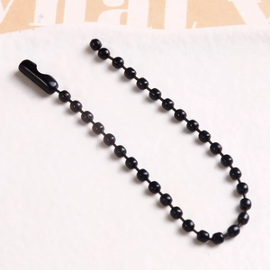 Detail of glossy black metal ball chain with secure connector for DIY accessories