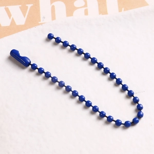 Close-up of blue beaded metal chain with connector clasp for DIY crafts and jewelry