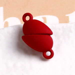 Detailed view of a red matte silicone heart clasp with dual rings for DIY jewelry design