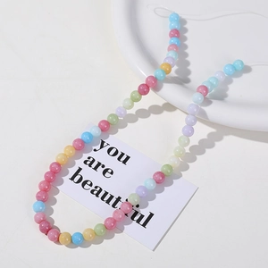 Detailed macro view of 8mm multicolored ice-crack natural stone beads for DIY jewelry