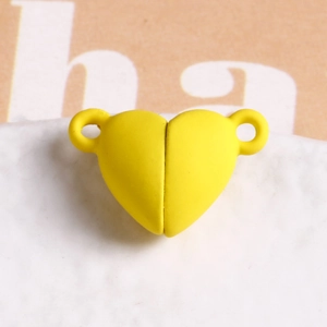 Detailed view of yellow matte heart-shaped magnetic clasp for DIY jewelry making