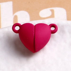 Close-up of rose red matte heart magnetic clasp connectors for DIY jewelry making
