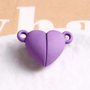 Macro view of purple matte heart magnetic clasp for DIY jewelry and bracelet assembly