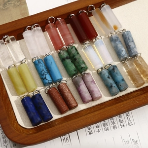 Set of cylindrical natural stone pendants with metal rings for DIY jewelry making