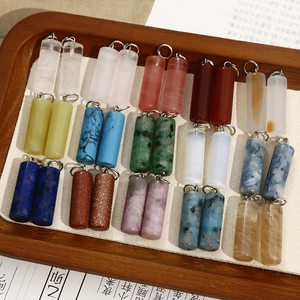 Variety of natural stone cylindrical pendants with metal rings for jewelry making
