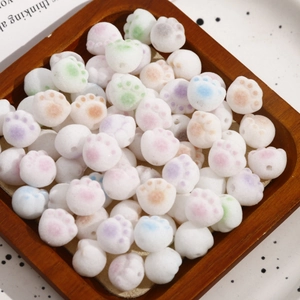 Close-up of cute flocked cat paw beads in multiple colors for DIY jewelry making