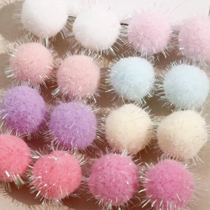Colorful plush pom poms with glitter tinsel for DIY jewelry making and crafts