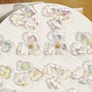 Close-up of AB gradient iridescent acrylic flower petals for DIY jewelry making
