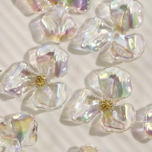 Detailed macro view of iridescent AB acrylic flower beads for DIY jewelry making
