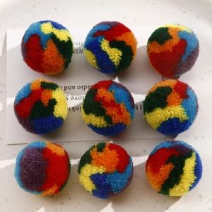 Macro shot of colorful 30mm handmade pompoms for jewelry making in a 3x3 grid layout