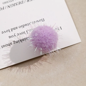 Macro shot of purple plush yarn ball with colorful glitter silk for DIY jewelry making