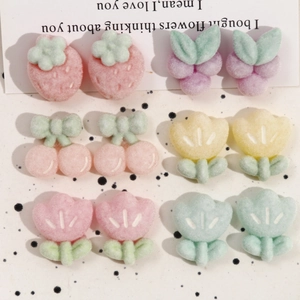 Flat lay of colorful resin fruit charms with a matte sugar texture for DIY jewelry