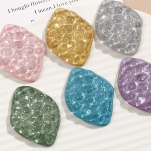 Flat back resin pebble charms with glitter finish and hammered texture for DIY crafts