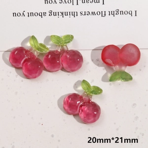 Detail view of 20x21mm cherry resin charms for DIY jewelry making with smooth finish