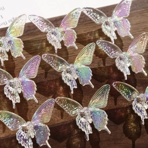 Macro shot of iridescent AB color acrylic swallowtail butterfly beads for DIY jewelry