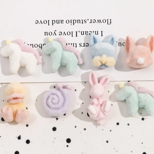 Close-up of cute 3D cartoon animal flocking resin charms in pastel macaron colors