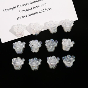 Close-up of 12pcs iridescent white acrylic rose flower charms for DIY jewelry making