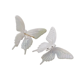 Exaggerated 3D butterfly hair accessories with iridescent pearlescent finish