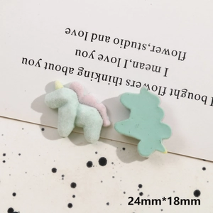 Detail of green flocked unicorn DIY charm showing front and side view with dimensions