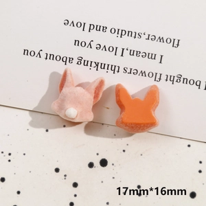 Macro detail of 17mm x 16mm cartoon fox animal resin and flocked DIY accessory