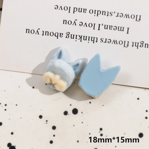 Detail of light blue flocked cat ear DIY accessories with small yellow bows, 18mm by 15mm