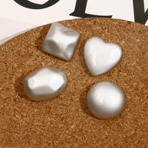 Glossy silver assorted shapes jewelry charms including heart and geometric patterns