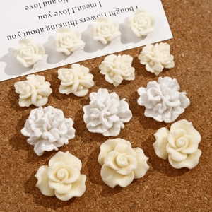 Detail shot of white flocked velvet rose and wrinkled flowers for DIY craft accessories