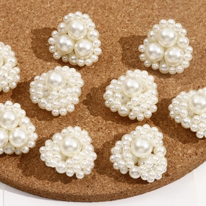 Macro shot of white heart-shaped faux pearl beads for DIY jewelry and accessories