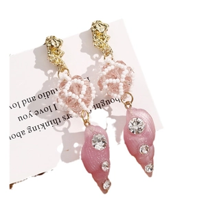 Elegant beaded crystal ball earrings with pink seashell pendants and sparkling rhinestones
