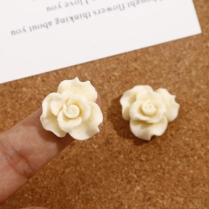Velvet rose DIY hair clip accessory in cream white shown for size measurement
