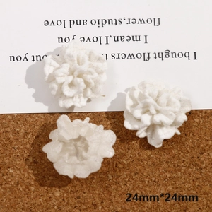 Detail showing three white flocked 3D rose patches for DIY jewelry making 24mm size