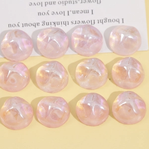 Macro shot of 18mm pink resin cabochons with starry glitter and water ripple texture