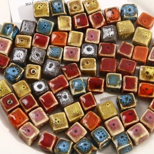 Macro shot of colorful square ceramic beads with kiln-glaze texture for DIY jewelry making