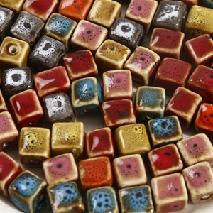 Macro shot of colorful glazed square ceramic beads for DIY jewelry making and necklaces