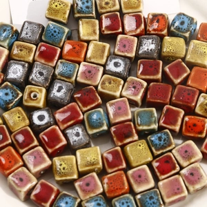 Close-up of colorful glazed square ceramic beads for DIY jewelry and handmade crafts