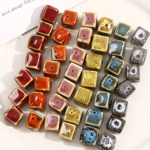 Close-up of square ceramic beads with speckled glaze finish in assorted colors