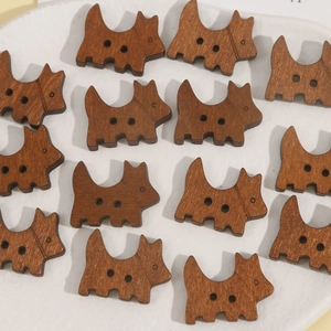 Macro view of cute dog-shaped wooden buttons with dual holes and natural wood grain