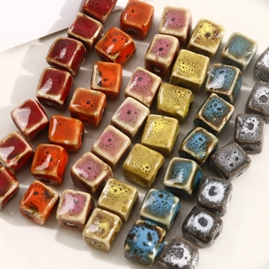 Detailed view of colorful square ceramic beads for DIY jewelry making and handmade crafts
