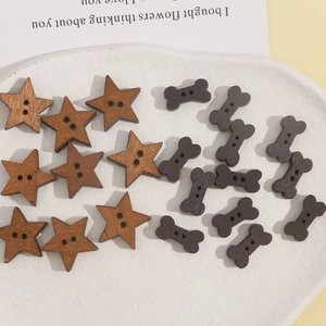 Close-up of wooden star and bone shaped two-hole buttons for DIY crafts and sewing