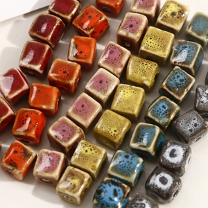 Macro detail of colorful glazed square ceramic beads for DIY handmade jewelry making