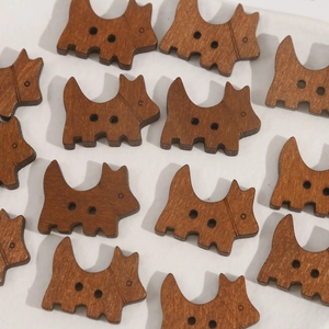 Cute brown wooden dog shaped buttons with two holes for DIY sewing and craft projects