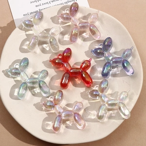 Macro detail of vibrant 3D acrylic balloon dog pendants with iridescent finish