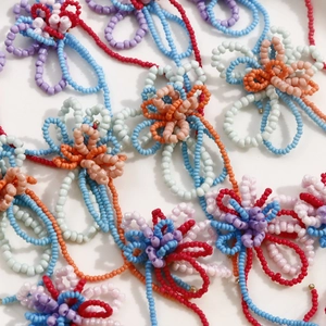 Handmade colorful beaded flower pendants for DIY jewelry making in various vibrant colors