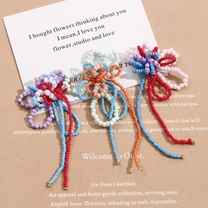 Handmade beaded flower hair clips with long tassel fringe in vibrant colorful sets
