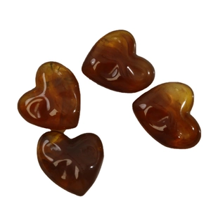 Irregular 3D resin heart pendants in amber with white ink marbling patterns